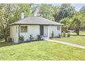 Newly renovated white brick ranch house with walkway at 713 Hudson Ave, Durham, NC 27704