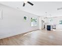 Bright, open-concept living room featuring hardwood floors and a view into the kitchen at 0 Cedar Grove Church Rd Rd, Roxboro, NC 27574