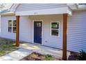 Newly constructed home's front entrance with a dark blue door and wood columns at 0 Theresia Ln, Roxboro, NC 27574