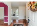 Warm and inviting foyer with hardwood floors and a glimpse of the living room fireplace at 1000 W Landing Dr, Sanford, NC 27330
