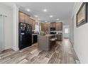 Open kitchen with island and stainless steel appliances at 117 Hinshaw Shop Rd, Liberty, NC 27298