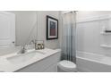 Clean bathroom with a white vanity, tub, and shower at 1320 White Verona Way, Knightdale, NC 27545