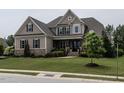 Charming home showcasing its meticulously maintained lawn and attractive architectural design at 1509 Yardley Dr, Wake Forest, NC 27587