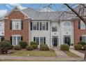 Two-story brick and siding townhouse with a charming front porch at 203 Anniston Ct, Cary, NC 27519