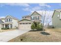 Beautiful two-story home with two-car garage, blue skies, and well-maintained lawn at 245 E Webber Ln, Clayton, NC 27527
