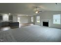 Spacious living room with hardwood floors, a fireplace, and an open floor plan at 395 Magnolia Run Way, Benson, NC 27504