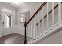 Interior view of a staircase with wooden handrail and hardwood flooring at 505 Great Eno Path, Hillsborough, NC 27278