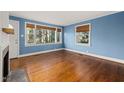 Bright living room featuring hardwood floors and many windows at 1813 University Dr, Durham, NC 27707