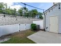 This cozy backyard with a privacy fence, offers a comfortable outdoor living space with string lights at 3836 Prince Noah Loop, Wake Forest, NC 27587