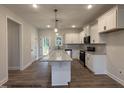Spacious kitchen with granite countertops, stainless steel appliances, and a large island at 3943 Baileys Xrds Rd, Benson, NC 27504