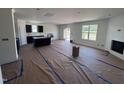 Open concept living area with a fireplace and seamless access to the kitchen at 3963 Baileys Xrds Rd, Benson, NC 27504