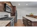 Updated kitchen features stainless steel appliances, granite countertops, and lots of cabinets at 500 Creek Valley Dr, Fuquay Varina, NC 27526
