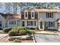 Charming townhouse exterior with mature landscaping and inviting facade at 751 Benchmark Dr, Raleigh, NC 27615