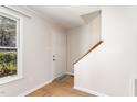 Inviting foyer with wood-look flooring and ample natural light at 751 Benchmark Dr, Raleigh, NC 27615