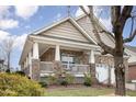 Inviting single-story brick home with a covered front porch perfect for relaxing at 812 Canyoncreek Ln, Fuquay Varina, NC 27526