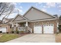 Beautifully designed single-story home with well-maintained landscaping and a two-car garage at 812 Canyoncreek Ln, Fuquay Varina, NC 27526