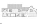 Detailed rear elevation displays the home's design with an inviting porch, expansive windows and classic elements at 975 Wilbon Rd, Holly Springs, NC 27540