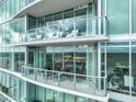 Spacious balcony with glass railings offers stunning city views at 110 N Corcoran St # 2304, Durham, NC 27701