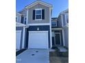 Charming townhome featuring two-car garage and contemporary two-tone exterior at 1117 Mountain Crown St, Durham, NC 27704