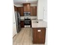 Well-equipped kitchen boasting granite countertops and stainless steel appliances at 1117 Mountain Crown St, Durham, NC 27704