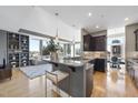 Open-concept kitchen with granite countertops, stainless steel appliances, and view of the living room at 400 W North St # 730, Raleigh, NC 27603