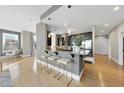 Modern kitchen with bar seating, granite countertops, stainless steel appliances and hardwood floors at 400 W North St # 730, Raleigh, NC 27603