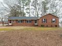 Cozy brick ranch with red shutters and a well-maintained lawn at 431 Mattox St, Wendell, NC 27591