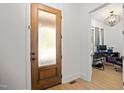 Inviting entryway featuring a decorative glass front door and view into adjacent home office at 5750 Nc Highway 49, Burlington, NC 27215
