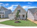 Charming single-Gathering home with a well-manicured lawn, a two-car garage, and a welcoming front porch at 9169 Dupree Meadow Dr # 26, Angier, NC 27501