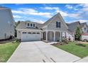 Charming single-Gathering home with a well-manicured lawn, a two-car garage, and a welcoming front porch at 9169 Dupree Meadow Dr # 26, Angier, NC 27501