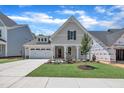 Charming single-Gathering home with a well-manicured lawn, a two-car garage, and a welcoming front porch at 9169 Dupree Meadow Dr # 26, Angier, NC 27501
