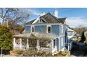 Beautiful two-story house featuring gray siding and a welcoming front porch at 101 S Bloodworth St, Raleigh, NC 27601