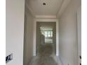 Hallway showing entry into another room that is lined with windows at 107 Willow Cameron Way, Angier, NC 27501