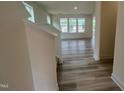 Open-concept living space with abundant natural light and modern flooring at 107 Willow Cameron Way, Angier, NC 27501