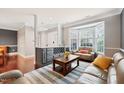 Cozy living room featuring a granite countertop bar, hardwood floors and lots of seating at 11213 Presidio Dr, Raleigh, NC 27617