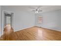 Bright bedroom with hardwood floors, ceiling fan, and neutral walls at 1721 Fountain St, Rocky Mount, NC 27801