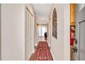 Inviting hallway with hardwood floors, white trim, and a stylish rug, creating a warm and welcoming atmosphere at 250 S Estes Dr # 10, Chapel Hill, NC 27514