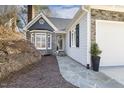 Exterior of the house showing stonework, a stone walkway, and a well-kept yard at 2949 Tillinghast Trl, Raleigh, NC 27613