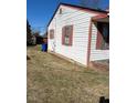 Angled side view of home with white siding and red shutters at 305 N State St, Raleigh, NC 27601