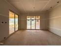 Bright dining space with large windows and sliding door, waiting for your personal touch and design at 436 Oakland Dr, Raleigh, NC 27609