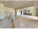 Expansive living room featuring open layout, smooth concrete floor, and natural light for customization at 436 Oakland Dr, Raleigh, NC 27609