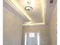 Well-lit foyer showcases elegant ceiling details, trim work, and a welcoming entrance at 622 Tart Town Rd, Dunn, NC 28334