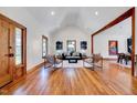 Spacious living room featuring high ceilings, hardwood floors, stylish furniture and an open design at 807 Vickers Ave, Durham, NC 27701
