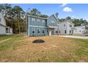 Beautiful two-story home featuring a blue exterior, pristine yard and concrete driveway at O Shortline Rd, Roxboro, NC 27574