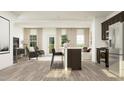 Bright open concept living room features neutral tones and flows into the kitchen at 1333 Hazelnut Ridge Ln, Knightdale, NC 27545