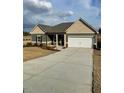 Inviting single-story home with a two-car garage and a well-maintained driveway at 19 Oriental St, Angier, NC 27501