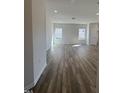 Bright living room featuring wood-look floors and natural light at 208 Bruce Dr Dr, Dunn, NC 28334