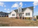 Charming one-story home with a manicured lawn and inviting front porch at 35 Henry Rifle Ln, Angier, NC 27501