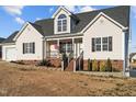 Charming one-story home with a manicured lawn and inviting front porch at 35 Henry Rifle Ln, Angier, NC 27501