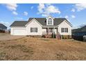 Charming one-story home with a manicured lawn and inviting front porch at 35 Henry Rifle Ln, Angier, NC 27501
